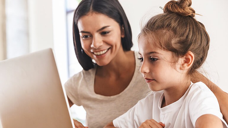 mother and daughter using a laptop